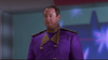 A man in a purple uniform with gold accents stands indoors against a blurry background, eyes closed, wearing a neutral expression—his look reminiscent of characters from Disney Channel originals or rare hard-to-find movies like the Zenon Girl of the 21st Century (1999) DVD.