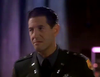 A man in a military uniform with dark hair stands indoors, looking slightly to the side with a serious expression—much like a character from the *Breach of Conduct (1994) DVD*. The background is out of focus, adding to the suspenseful atmosphere reminiscent of this rare movie on DVD.