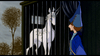A white unicorn stands behind bars in a dark cage while a person in a blue cloak and pointed hat gazes at it. Trees and a cloudy sky form the backdrop, capturing the magical atmosphere of an animated fantasy film, reminiscent of rare classic movies like The Last Unicorn (1982) DVD.
