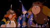 Three animated fantasy characters from “The Last Unicorn (1982)” stand together; one sports a feathered hat and red mustache, another dons a blue pointed hat in the film’s signature whimsical style, and the third is large, wearing a cap with tools strapped to his belt.
