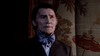 A man in a formal suit and cravat with a serious expression, evocative of gothic horror, looks toward the right side of the frame on the cover of the Dracula (1974) DVD.