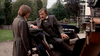 A man in a suit sits in a horse-drawn carriage talking to another man in this scene from the Dracula (1974) DVD, evoking a gothic horror atmosphere.