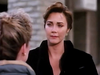 A woman with short brown hair and a serious expression stands outside, facing another person whose back is to the camera, evoking the tense atmosphere often found in rare classic movies or a dramatic scene from Lightning In A Bottle DVD (1993).