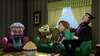 Four animated characters sit on a green couch in a cozy living room, surprised expressions on their faces as they huddle around a big bowl of popcorn. Sunlight streams through windows with green curtains, creating the perfect atmosphere for enjoying Dear Dracula (2012) DVD during a fun-filled Halloween family movie night or when revisiting this rare classic.