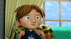 A wide-eyed animated boy with brown hair sits on a colorful patterned chair in front of a window with curtains, wearing a dark blue shirt featuring a dragon graphic. He looks surprised or excited—perhaps after discovering one of his favorite rare movies on DVD, such as the Dear Dracula (2012) DVD Halloween movie.