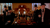 Four men in Victorian attire and top hats stand in an ornate, wood-paneled room, reminiscent of scenes from Tall Tale (1995) DVD as they look toward the camera.