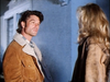 A man in a tan jacket with a shearling collar looks toward a woman seen from behind on the cover of the Murder So Sweet (1993) DVD.