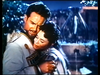 Steve Reeves in a military uniform embraces a woman in front of a fountain in a scene from The White Warrior (1959) DVD, reminiscent of classic movies.