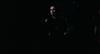 A man with a serious expression illuminated in a dark setting on the cover of The House Where Death Lives (1981) DVD, reminiscent of a classic horror thriller.
