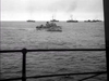 A black-and-white view from the deck of a ship looking out at a British naval convoy in a scene from The Cruel Sea (1953) DVD.
